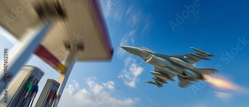 A moving fighter jet and fuel pumps blend with the blue sky.