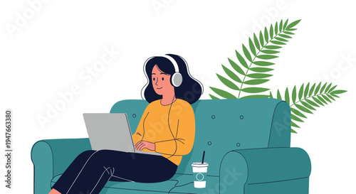 Young woman sitting on a comfortable sofa and working on her laptop while listening to music with headphones in a cozy setting.