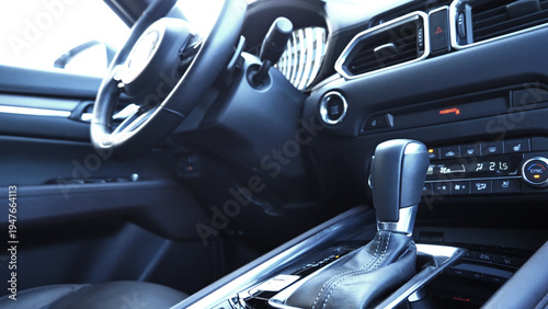 Stylized Image Of Front Part Of Car Interior With Blurred By The Sunlight Steering Wheel  
