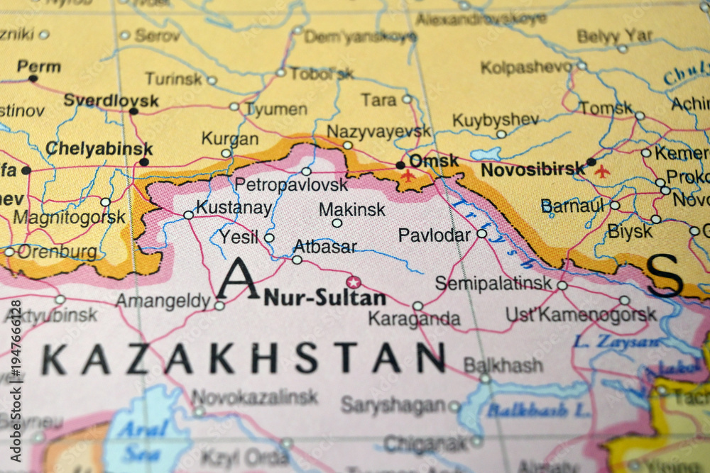 Naklejka premium Defocused Map Background Highlighting Makinsk Geography and Travel Concept