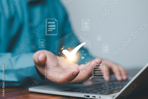 Fotografía Business professional presenting digital document verification with approval check mark above laptop