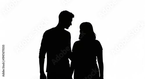 Silhouette of a couple standing together looking at each other.