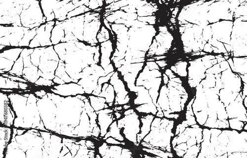 Black and white cracked surface texture with irregular jagged lines and weathered patterns