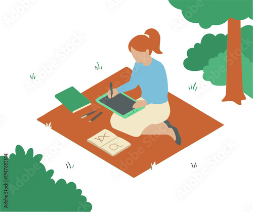 Woman sitting on blanket in park using graphics tablet and laptop outdoors