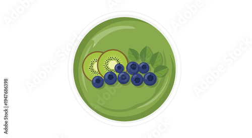 A vibrant green smoothie bowl topped with fresh fruit and mint