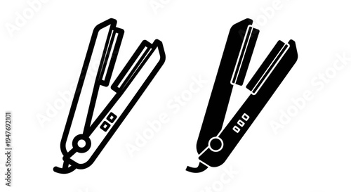 Two black and white hair straighteners on a plain white surface for styling