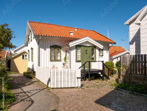 Traditional wooden house along small street in Grundsund village on Skaftö island, Bohuslän archipelago, west coast of Sweden