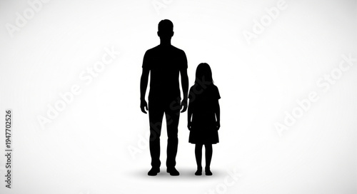 Silhouette of a father and daughter standing together.