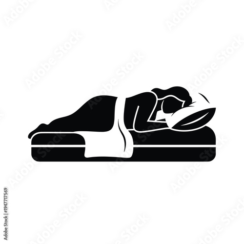 Person sleeping on stomach in bed.