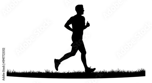 Silhouette of a man running outdoors on grass.