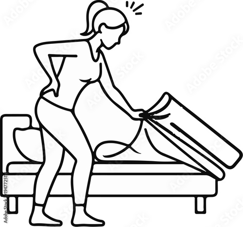 Person experiencing back pain while making a bed with sheets