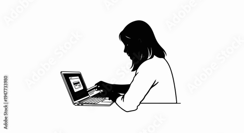 Silhouette of a person using a credit card on a laptop for online transactions