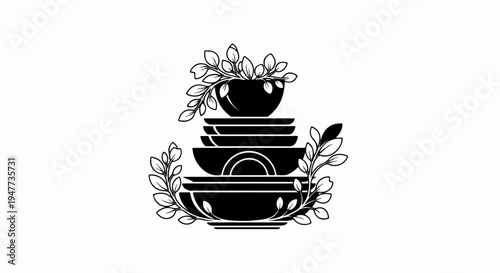 Stacked dishes adorned with delicate leafy branches