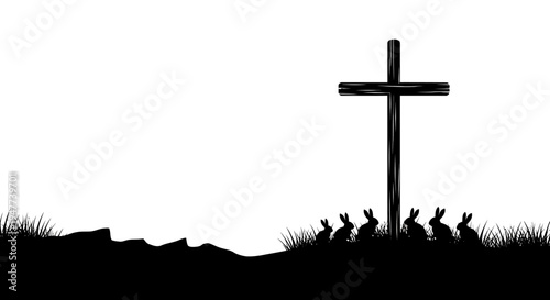 Silhouette of a cross and rabbits on a grassy hill.