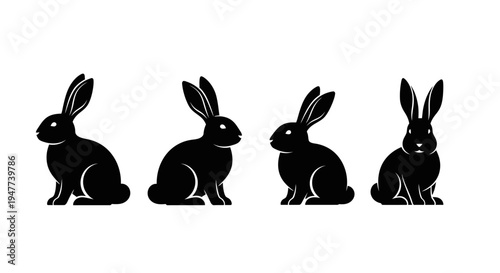 Four black rabbit silhouettes in various poses on a white background.