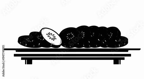 Slices of fruit arranged on a simple black platter