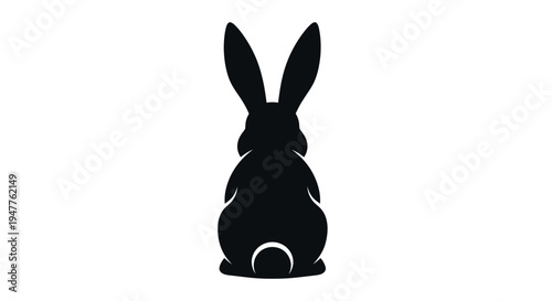 Black Rabbit Silhouette with Fluffy Tail Facing Away.