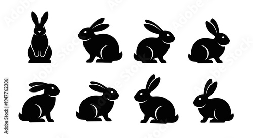 Collection of black rabbit silhouettes in various poses, showcasing their distinct shapes and forms.