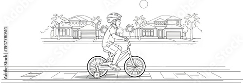 Young child on bicycle with training wheels rides down suburban street