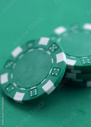 Wallpaper Mural Green casino poker chips on green gaming table close up. Few amount of green casino chips Torontodigital.ca