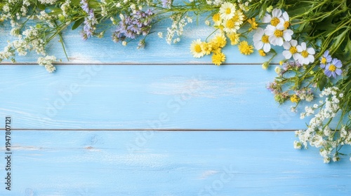 Floral Embellishment on Pastel Timber: A delicate garland of wildflowers, each petal painted with the vibrant hues of spring, elegantly frames a light blue, weathered wooden surface.