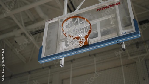 Bottom view of basketball hoop without ball, filmed in motion