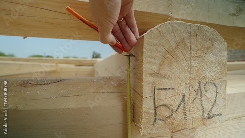 The process of assembling a wooden house from timber. Details