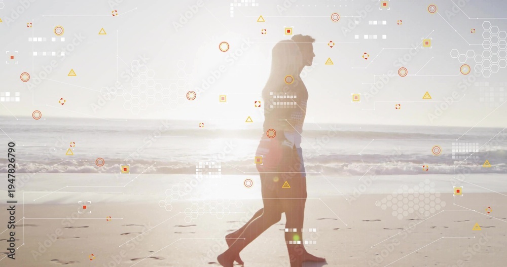 Obraz premium Walking couple in swimwear strolling along wet sand with footprints near waves, digital overlays