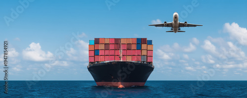 large cargo ship loaded with colorful containers sails on the ocean while a plane flies overhead under a blue sky with clouds.