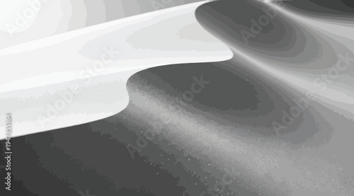 A grayscale image of a white object on a dark surface with light shining on it creating a gradient effect