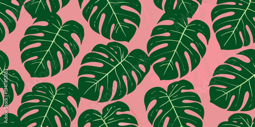 Seamless pattern of vibrant monstera leaves on a pink background