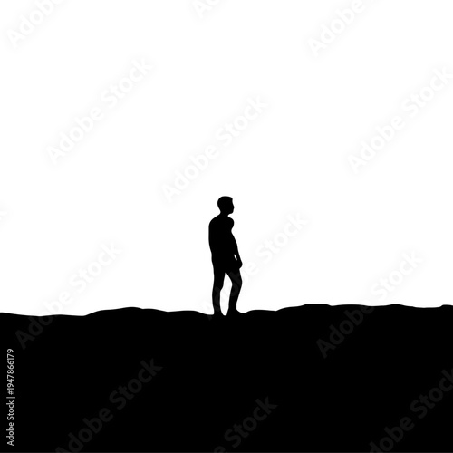 silhouette of a man standing on the rocks
