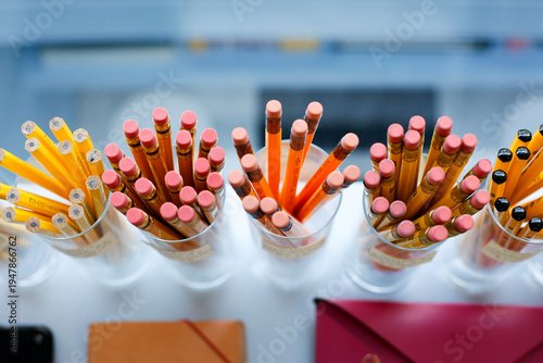 Pencils in Cups on Classroom Desk