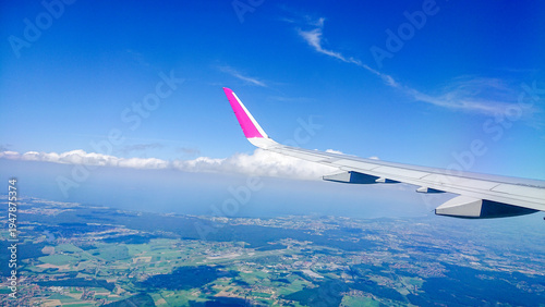 Aftersunset sky, bright blue, dotted with soft white clouds