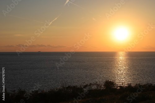 The sun falling into the sea