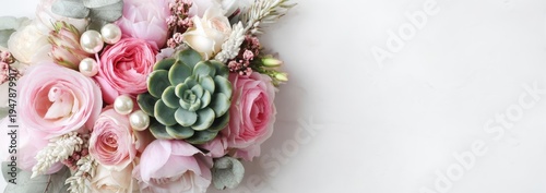 Beautiful pastel floral arrangement with roses and succulents on a white background.