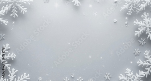 Elegant winter holiday design with a snowflake border around a soft gray background viewed from above, copy space included