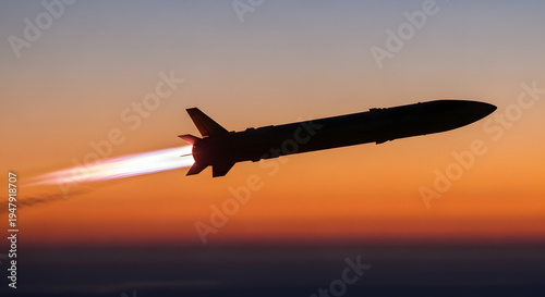 Silhouette of a Missile Launching Against a Vibrant Sunset Sky