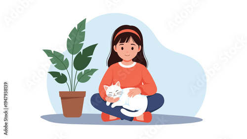 Contented young girl sitting cross-legged and gently petting her white cat on lap in cozy room with large houseplant.