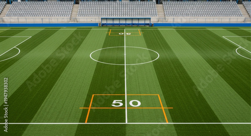 Aerial View of a Football Field with Yard Lines and Markings.