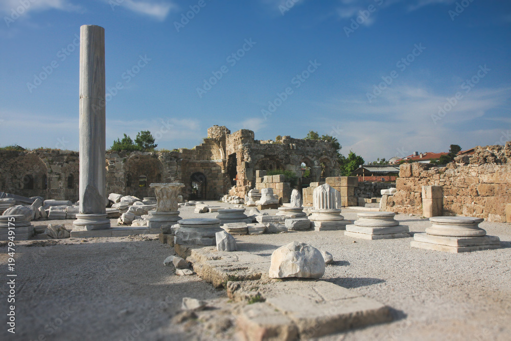 Fototapeta premium Archaeological site with marble columns and ruins in Side, Turkey