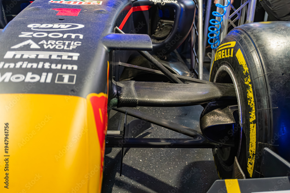 Obraz premium Red Formula 1 car on display, red, white, black accents, Infiniti, Mobil sponsor logos, aerodynamic design, front wing assembly with adjustable elements, complex str - Kyiv, Ukraine - June 8, 2025