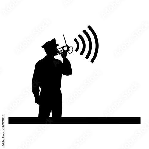 Silhouette of man holding walkie talkie.