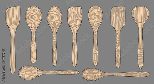 A set of wooden kitchen utensils, including various types of spoons and spatulas, arranged on a neutral gray background, showcasing a natural lifestyle and culinary tools.