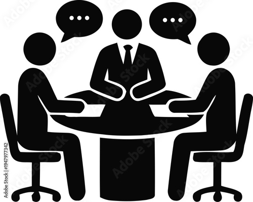 Three people sitting around a table talking to each other in business meeting