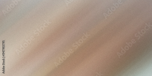 A blurry image of a brown and pink object on a gray background