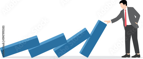 Businessman stopping domino effect with his hand