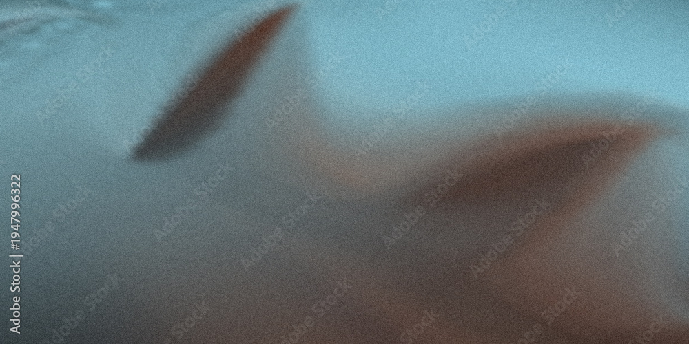 Obraz premium A Blurry Image of a Shark or Fish Swimming in the Ocean Water
