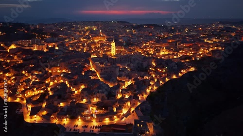 Aerial night view of the illuminated Sassi di Matera, Basilicata, Italy