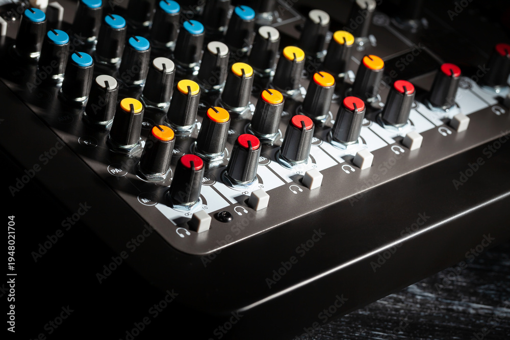Fototapeta premium recording mixer knobs on black background